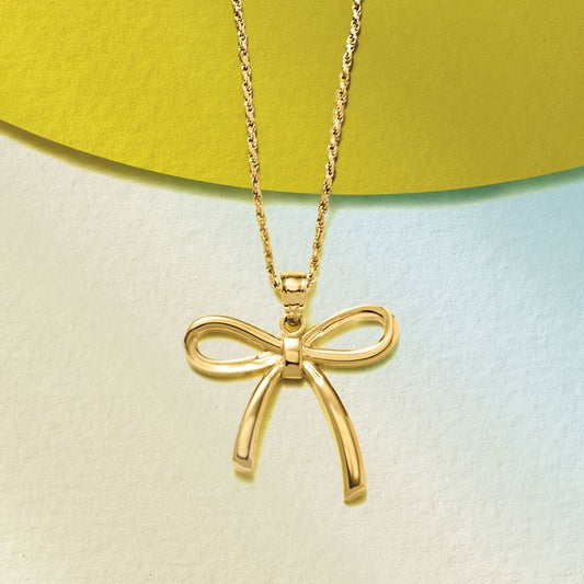 Gold bow pendent