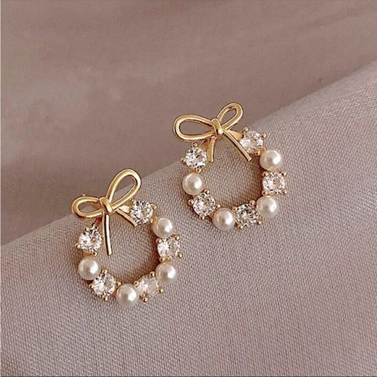 Bow pearl round earring