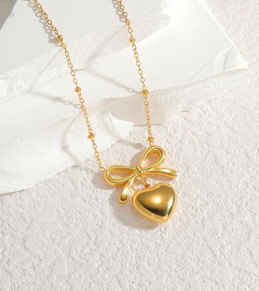 golden heart shape bow pendent
