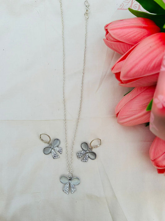 Bow ad charm pendent and earring combo